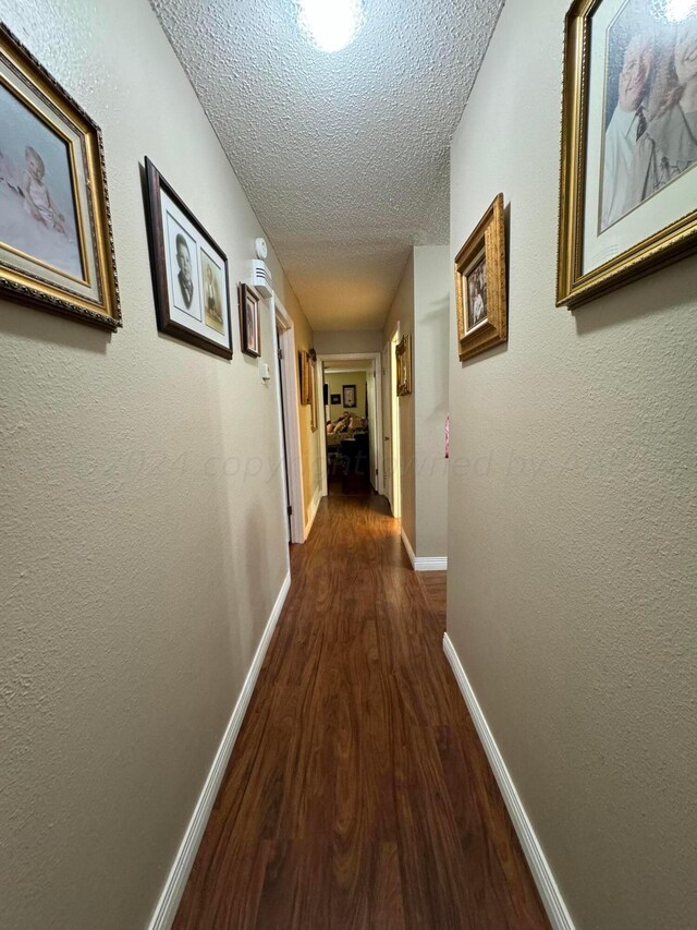7204 SW 39th Ave, Amarillo, TX 79109 - hall with dark wood-type flooring and a textured ceiling