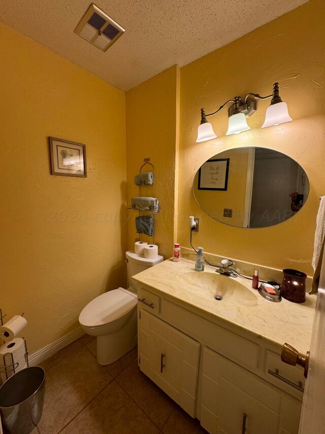 7204 SW 39th Ave, Amarillo, TX 79109 - bathroom featuring vanity, tile patterned floors, and a textured ceiling