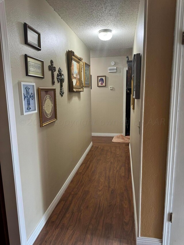 7204 SW 39th Ave, Amarillo, TX 79109 - hallway featuring dark wood-style flooring and a textured ceiling