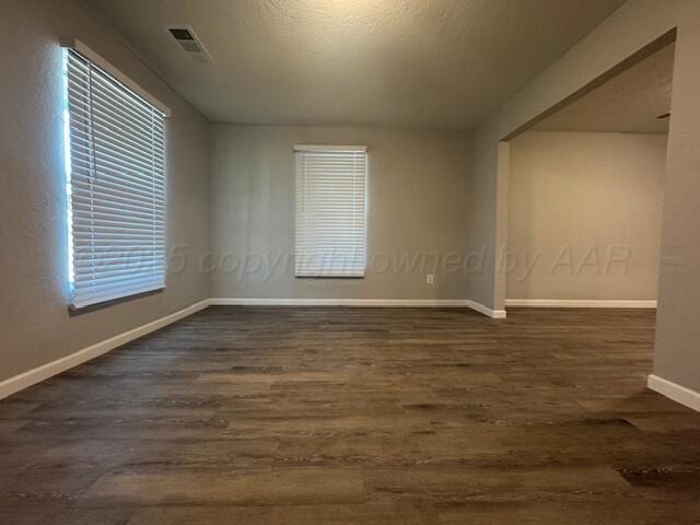 1602 N Hughes St, Amarillo, TX 79107 - unfurnished room with wood finished floors and baseboards