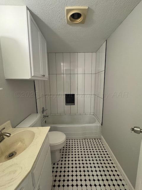1602 N Hughes St, Amarillo, TX 79107 - full bath with a textured ceiling, vanity, and tile patterned floors