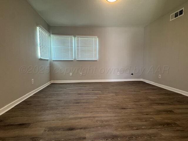 1602 N Hughes St, Amarillo, TX 79107 - spare room with dark wood finished floors