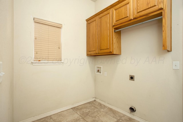 washroom with cabinet space, hookup for an electric dryer, baseboards, and washer hookup