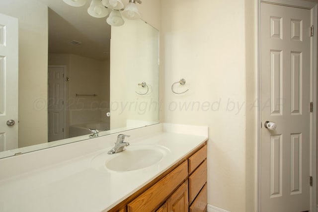 bathroom with visible vents and vanity