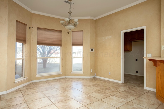 unfurnished dining area with visible vents, baseboards, ornamental molding, an inviting chandelier, and light tile patterned flooring