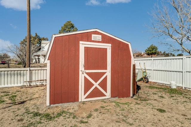 view of shed with a fenced backyard