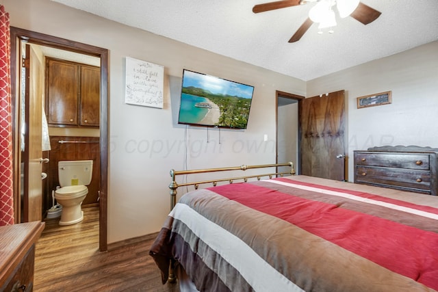 bedroom with dark wood-style floors, ceiling fan, a textured ceiling, and ensuite bathroom