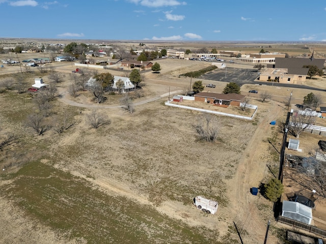 birds eye view of property with view of desert