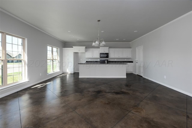 unfurnished living room with crown molding and an inviting chandelier