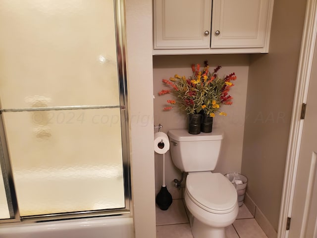 bathroom featuring toilet and tile patterned flooring