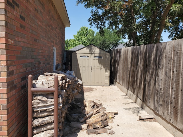 view of patio with a storage shed