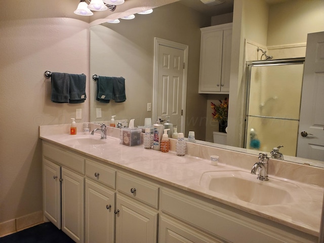 bathroom featuring walk in shower and vanity