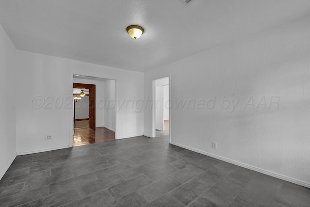 empty room with baseboards