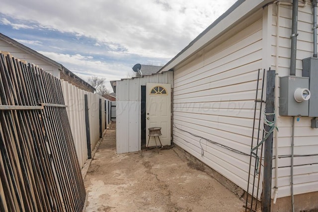 view of home's exterior featuring fence