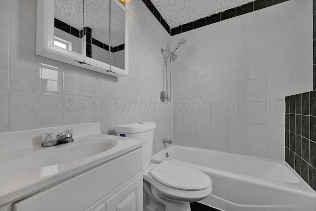 full bathroom featuring toilet, shower / tub combination, tile walls, and vanity