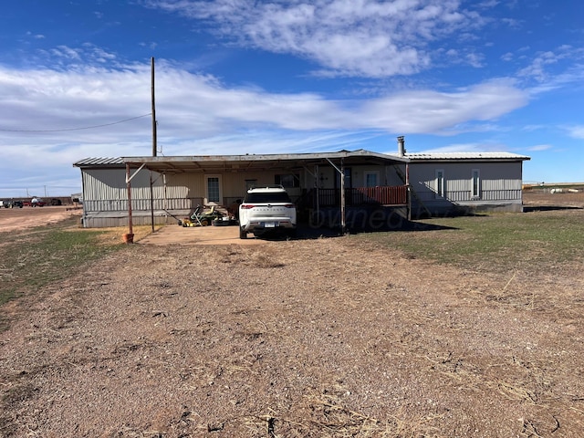 exterior space with a carport