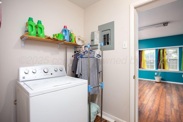 washroom featuring laundry area, baseboards, washer / dryer, and wood finished floors