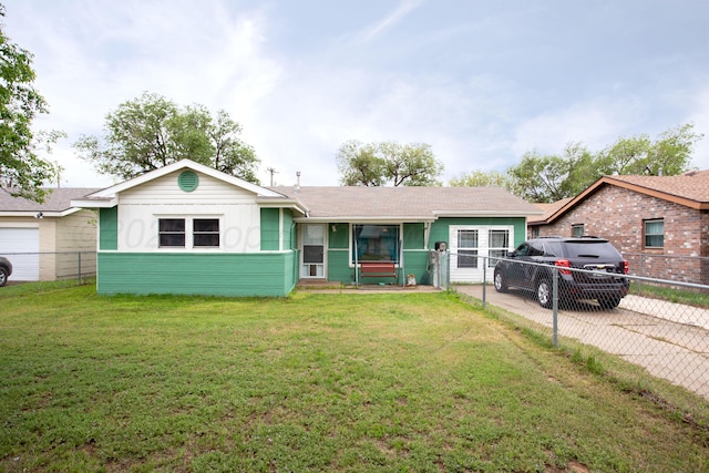 ranch-style house with fence and a front lawn