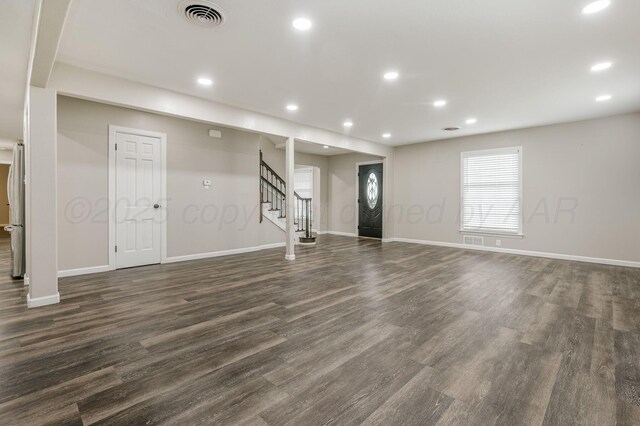 2421 Duncan St, Pampa, TX 79065 - unfurnished living room featuring stairs, recessed lighting, dark wood-style flooring, and baseboards