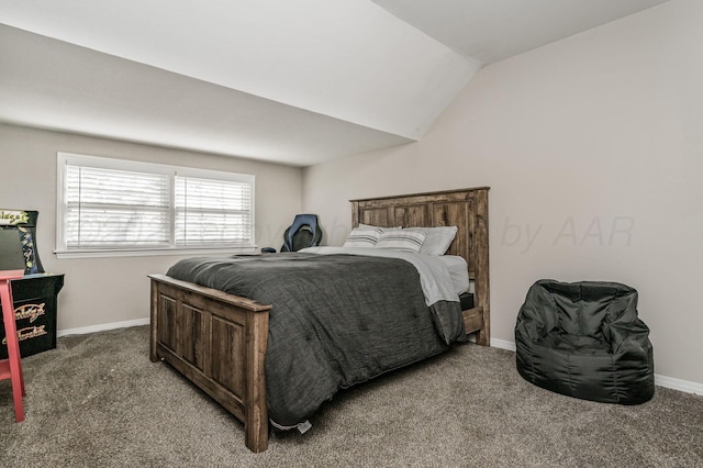bedroom featuring carpet floors, baseboards, and lofted ceiling