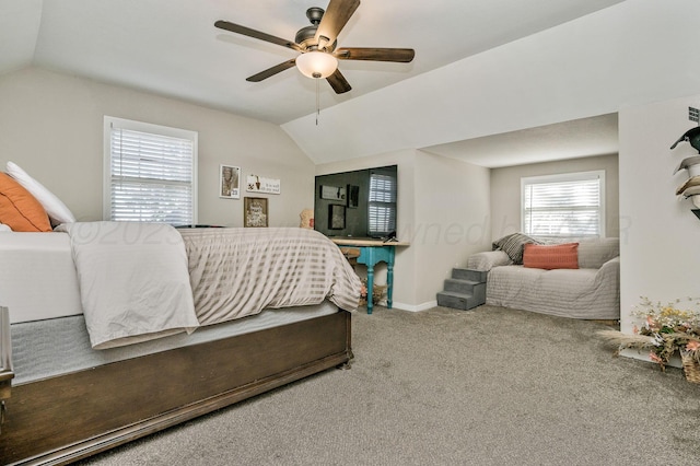 bedroom with baseboards, carpet flooring, ceiling fan, and lofted ceiling