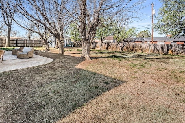 view of yard featuring a patio area and a fenced backyard