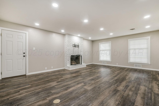 2421 Duncan St, Pampa, TX 79065 - unfurnished living room featuring dark wood finished floors, baseboards, a fireplace, and recessed lighting