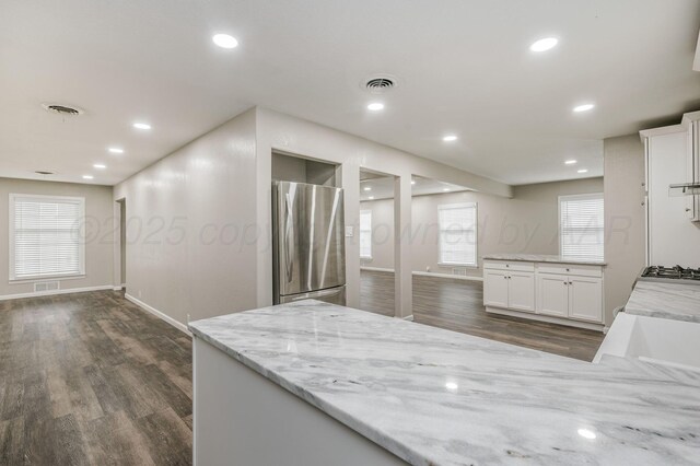 2421 Duncan St, Pampa, TX 79065 - kitchen featuring freestanding refrigerator, dark wood finished floors, white cabinetry, baseboards, and recessed lighting