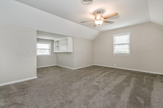 2421 Duncan St, Pampa, TX 79065 - bonus room featuring vaulted ceiling, carpet floors, ceiling fan, and baseboards