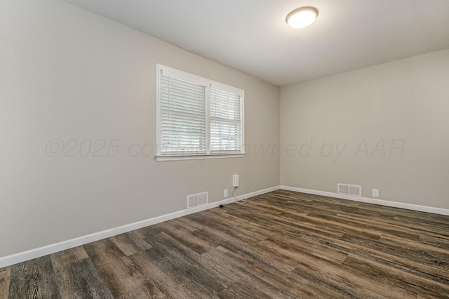 2421 Duncan St, Pampa, TX 79065 - empty room featuring dark wood-style floors and baseboards