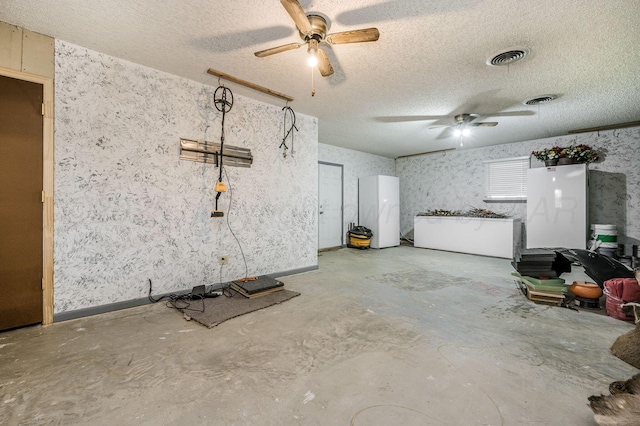 garage with white fridge and fridge