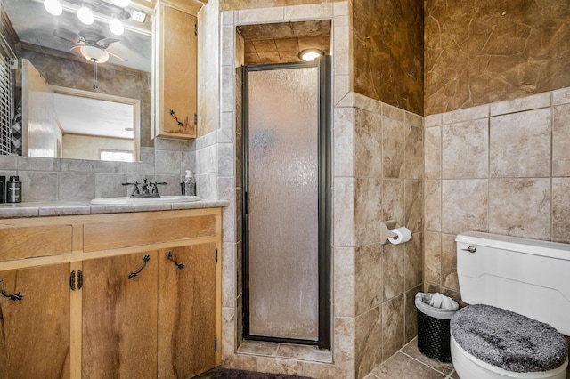 bathroom featuring tile patterned flooring, vanity, backsplash, toilet, and a shower with shower door