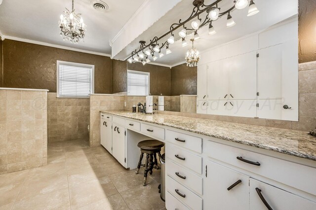 bathroom featuring vanity, tile walls, and crown molding