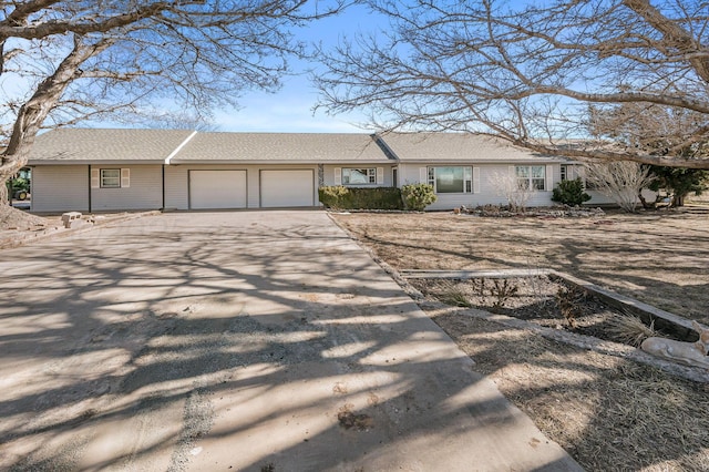 single story home featuring a garage