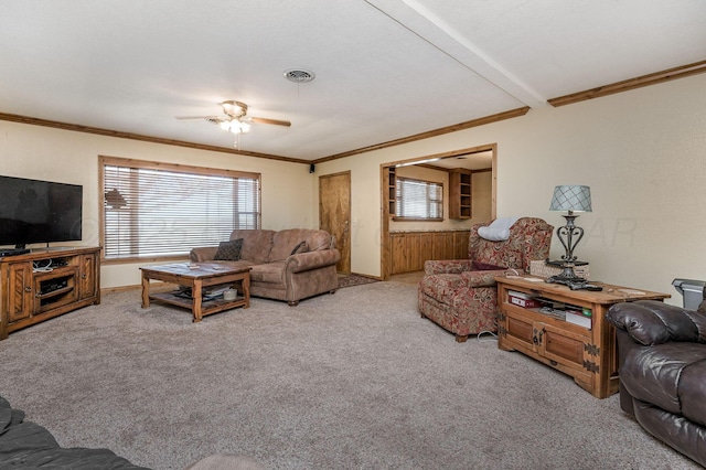 living room featuring light carpet, ceiling fan, and a wealth of natural light