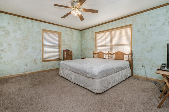 carpeted bedroom featuring ceiling fan and crown molding