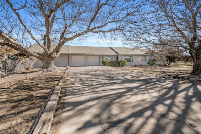 single story home featuring a garage