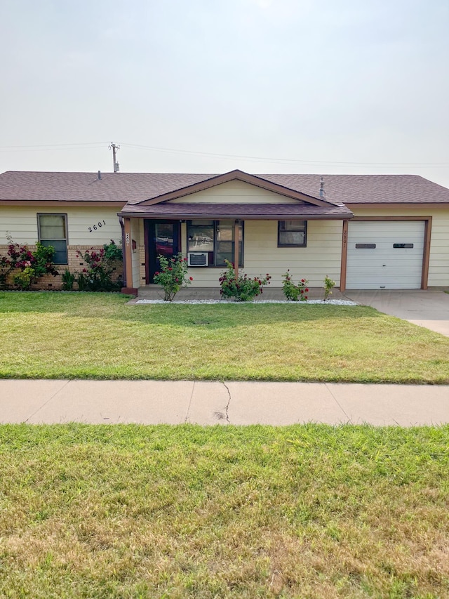 2601 N Highland St, Amarillo, TX 79107 - single story home featuring driveway, a front lawn, an attached garage, and a shingled roof