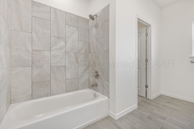 307 S Tennessee St, Amarillo, TX 79106 - bathroom featuring baseboards, wood finish floors, and bathing tub / shower combination