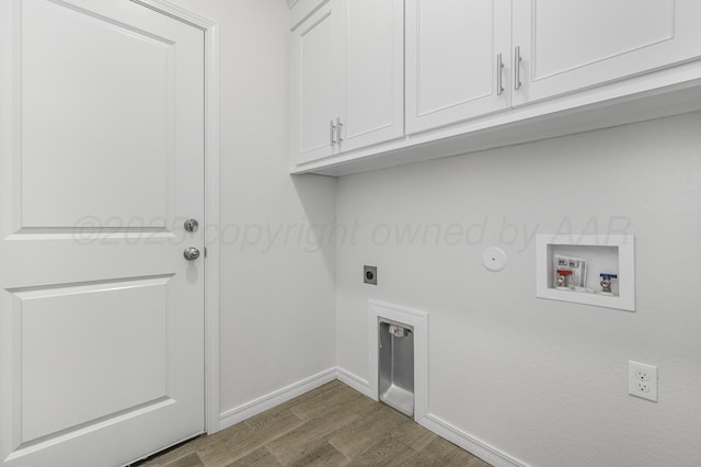 307 S Tennessee St, Amarillo, TX 79106 - washroom with cabinet space, dark wood-style flooring, hookup for a washing machine, baseboards, and hookup for an electric dryer