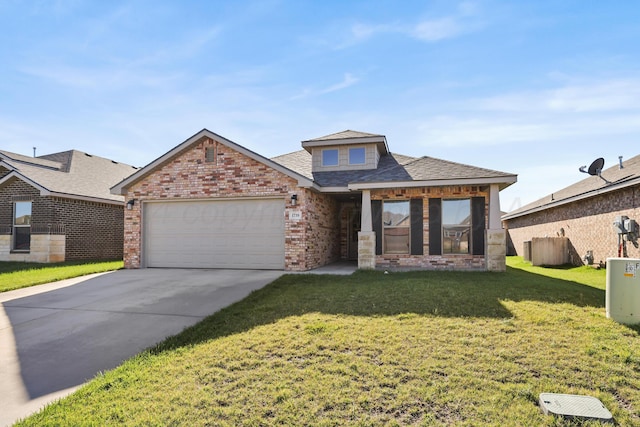 view of front of property with a garage and a front lawn