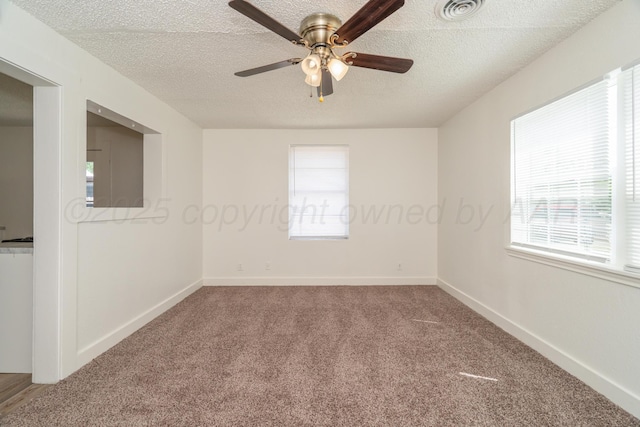 4106 S Jackson St, Amarillo, TX 79110 - empty room featuring carpet floors, plenty of natural light, a textured ceiling, and a ceiling fan