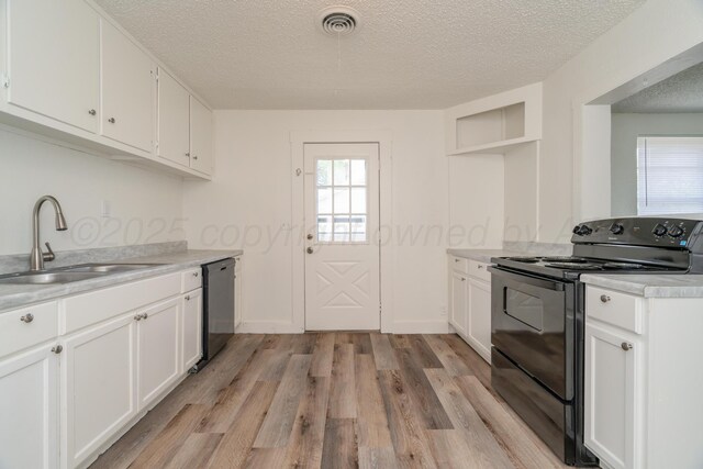 4106 S Jackson St, Amarillo, TX 79110 - kitchen featuring black / electric stove, dishwasher, a textured ceiling, plenty of natural light, and light wood-style floors