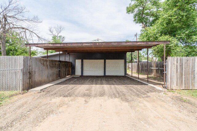 4106 S Jackson St, Amarillo, TX 79110 - view of parking / parking lot with a detached garage