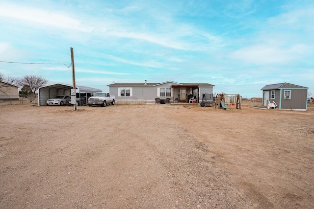 exterior space featuring a shed and a carport