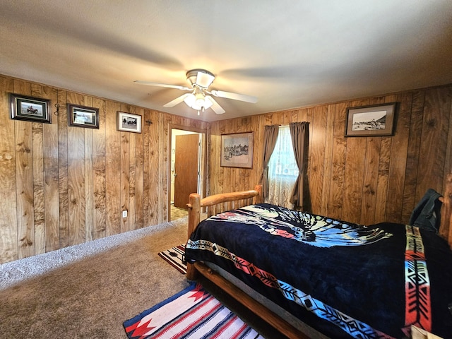 bedroom with wooden walls, carpet floors, and a ceiling fan
