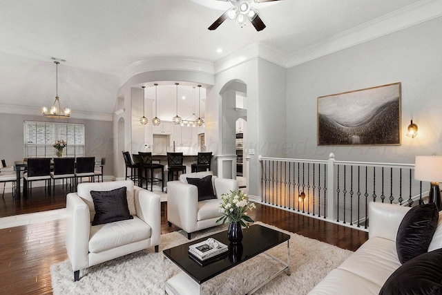 6501 Glenwood Dr, Amarillo, TX 79119 - living area with arched walkways, recessed lighting, ceiling fan with notable chandelier, crown molding, and hardwood / wood-style flooring