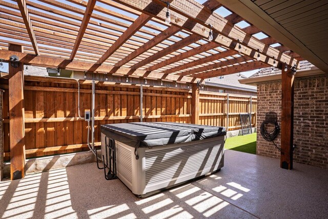 6501 Glenwood Dr, Amarillo, TX 79119 - view of patio / terrace with a hot tub and fence
