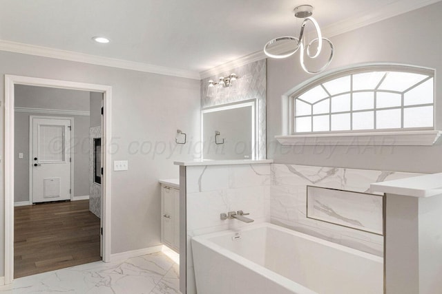 6501 Glenwood Dr, Amarillo, TX 79119 - bathroom with marble finish floor, vanity, crown molding, baseboards, and a garden tub