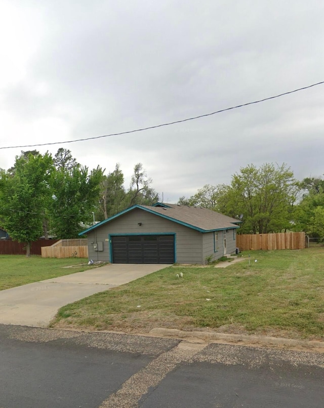 exterior space with a garage and a front yard